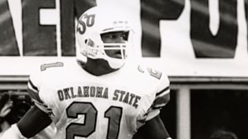 Oct 15, 1988; Lincoln, NE, USA; FILE PHOTO; Oklahoma State Cowboys running back Barry Sanders (21) after scoring a touchdown against the Nebraska Cornhuskers at Memorial Stadium. Mandatory Credit: Malcolm Emmons-Imagn Images