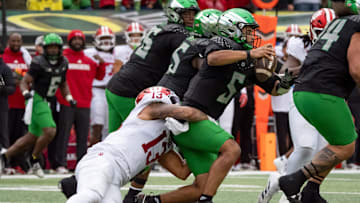 Indiana defensive lineman Kellan Wyatt sacks Oregon quarterback Dante Moore as the Oregon Ducks host the Indiana Hoosiers Oct. 11, 2025, at Autzen Stadium in Eugene, Oregon.