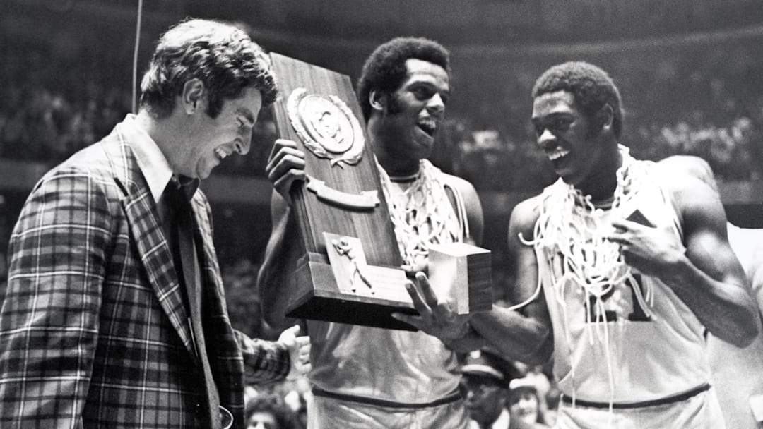 Mar 29, 1976; Philadelphia, PA; Indiana head coach Bobby Knight, forward Scott May, and guard Quinn Buckner (21) celebrate after winning the 1976 NCAA basketball championship. The Hoosiers beat the Wolverines 86-68. Mar 29, 1976; Philadelphia, PA; Indiana head coach Bobby Knight, forward Scott May, and guard Quinn Buckner (21) celebrate after winning the 1976 NCAA basketball championship. The Hoosiers beat the Wolverines 86-68.