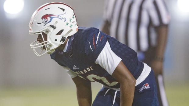 Chaminade-Madonna's Zaquan Patterson (12) prepares to tackle a Berkeley Prep player. 