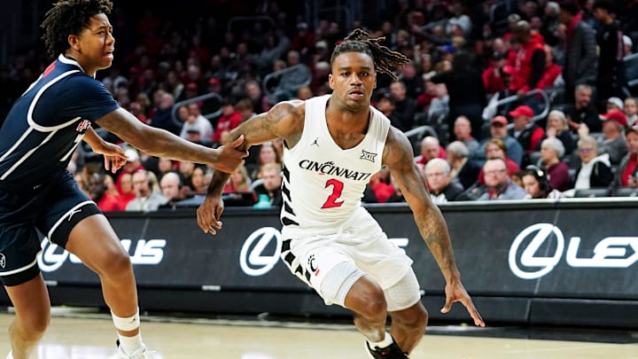 Cincinnati Bearcats guard Jizzle James (2) drives down the court with the ball in the first half of a college basketball game between the Cincinnati Bearcats and Howard Bison, Sunday, Dec. 8, 2024, at Fifth Third Arena in Cincinnati.