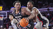Jan 28, 2025; Athens, Georgia, USA; South Carolina Gamecocks forward Collin Murray-Boyles (30) dribbles against Georgia Bulldogs forward RJ Godfrey (10) at Stegeman Coliseum. Mandatory Credit: Dale Zanine-Imagn Images