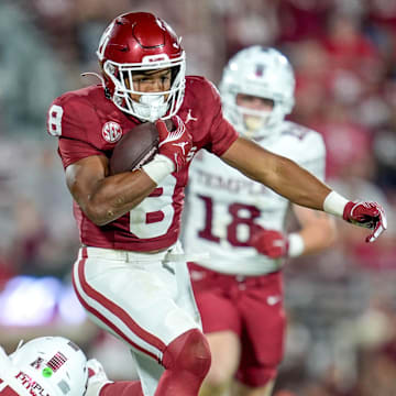 Oklahoma running back Taylor Tatum (8) runs the ball in the second half of an NCAA football game between Oklahoma (OU) and Temple at the Gaylord Family Oklahoma Memorial Stadium in Norman, Okla., on Friday, Aug. 30, 2024.