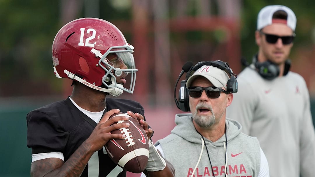 July 30, 2025; Tuscaloosa, AL, USA; Quarterback Keelon Russell drops back under the watch of offensive coordinator Ryan Grubb during the first practice session of the preseason for the Alabama Crimson Tide. 