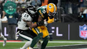 Green Bay Packers wide receiver Christian Watson catches a touchdown against Philadelphia Eagles cornerback Avonte Maddox