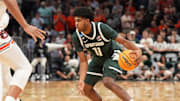 Michigan State Spartans guard Jase Richardson (11) dribbles during the first half in the South Regional final of the 2025 NCAA tournament against the Auburn Tigers at State Farm Arena. 
