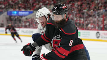 May 22, 2025; Raleigh, North Carolina, USA;  Carolina Hurricanes defenseman Brent Burns (8) defends against Florida Panthers forward Carter Verhaeghe (23) during the second period in game two of the Eastern Conference Final of the 2025 Stanley Cup Playoffs at Lenovo Center. Mandatory Credit: James Guillory-Imagn Images