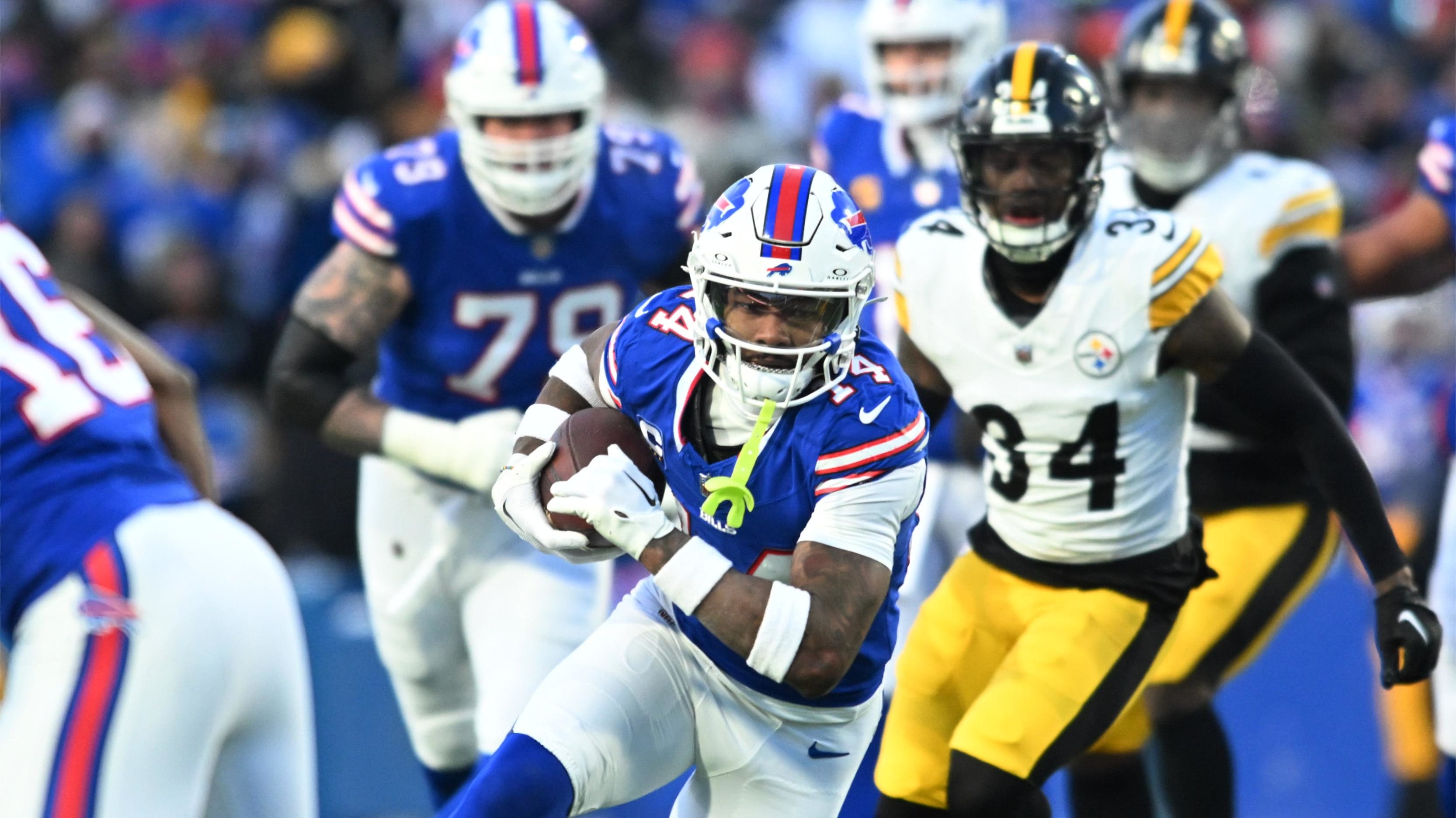 Buffalo Bills wide receiver Stefon Diggs runs carrying a football.