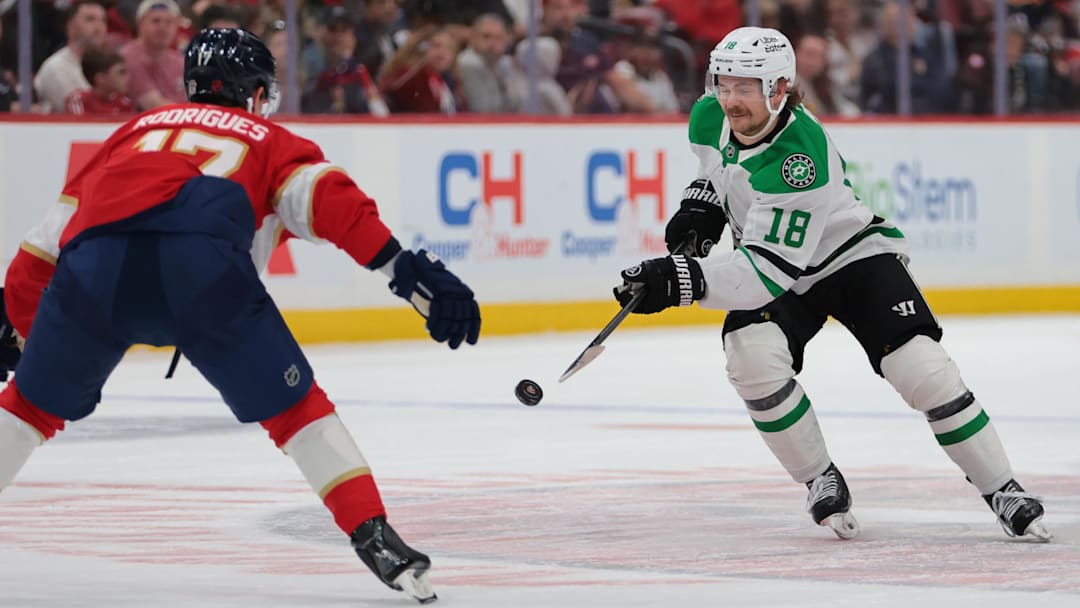 Nov 1, 2025; Sunrise, Florida, USA; Dallas Stars center Sam Steel (18) moves the puck agains tFlorida Panthers center Evan Rodrigues (17) during the first period at Amerant Bank Arena. Mandatory Credit: Sam Navarro-Imagn Images