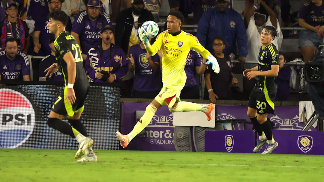 Oct 4, 2025; Orlando, Florida, USA; Orlando City SC goalkeeper Pedro Gallese (1) makes a stop against the Columbus Crew during the second half at Inter&Co Stadium. Mandatory Credit: Kim Klement Neitzel-Imagn Images