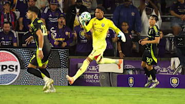 Oct 4, 2025; Orlando, Florida, USA; Orlando City SC goalkeeper Pedro Gallese (1) makes a stop against the Columbus Crew during the second half at Inter&Co Stadium. Mandatory Credit: Kim Klement Neitzel-Imagn Images