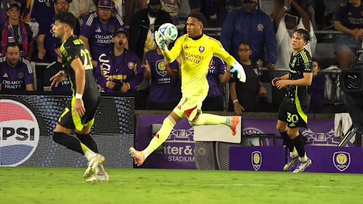 Oct 4, 2025; Orlando, Florida, USA; Orlando City SC goalkeeper Pedro Gallese (1) makes a stop against the Columbus Crew during the second half at Inter&Co Stadium. Mandatory Credit: Kim Klement Neitzel-Imagn Images