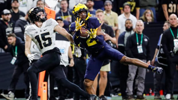 Michigan defensive back Will Johnson intercepts a pass intended for Purdue wide receiver Charlie Jones