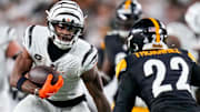 Cincinnati Bengals wide receiver Ja’Marr Chase (1) runs with a catch in the fourth quarter of the NFL Week 7 game between the Cincinnati Bengals and the Pittsburgh Steelers at Paycor Stadium in downtown Cincinnati on Thursday, Oct. 16, 2025. The Bengals won, 33-31.
