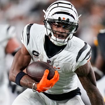 Cincinnati Bengals wide receiver Ja’Marr Chase (1) runs with a catch in the fourth quarter of the NFL Week 7 game between the Cincinnati Bengals and the Pittsburgh Steelers at Paycor Stadium in downtown Cincinnati on Thursday, Oct. 16, 2025. The Bengals won, 33-31.
