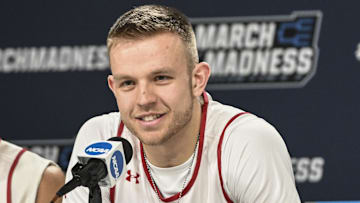 Mar 17, 2022; Milwaukee, WI, USA; Wisconsin Badgers guard Brad Davison (34) answers questions during practice before the first round of the 2022 NCAA Tournament at Fiserv Forum. Mandatory Credit: Benny Sieu-Imagn Images