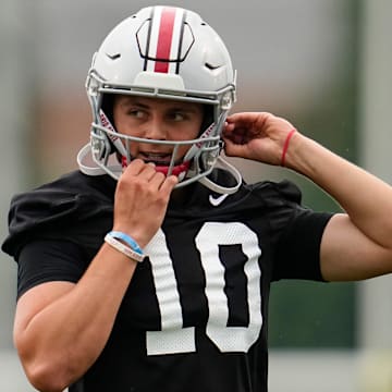 Ohio State Buckeyes quarterback Julian Sayin (10) buckles his helmet during the first football practice of the season at the Woody Hayes Athletic Center on July 31, 2025.
