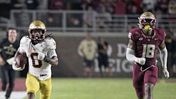 Sep 2, 2024; Tallahassee, Florida, USA; Boston College Eagles running back Treshaun Ward (0) runs the ball down the field past Florida State Seminoles linebacker Cam Riley (18) during the game at Doak S. Campbell Stadium. Mandatory Credit: Melina Myers-USA TODAY Sports