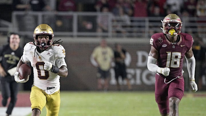 Sep 2, 2024; Tallahassee, Florida, USA; Boston College Eagles running back Treshaun Ward (0) runs the ball down the field past Florida State Seminoles linebacker Cam Riley (18) during the game at Doak S. Campbell Stadium. Mandatory Credit: Melina Myers-USA TODAY Sports