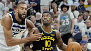 May 6, 2025; Minneapolis, Minnesota, USA; Golden State Warriors forward Jimmy Butler (10) goes to the basket against Minnesota Timberwolves center Rudy Gobert (27) in the fourth quarter during game one of the second round for the 2025 NBA Playoffs at Target Center. Mandatory Credit: Bruce Kluckhohn-Imagn Images