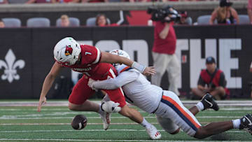 Louisville’s Miller Moss gets sacked and temporarily losses the ball against Virginia’s Mitchell Melton at L&N Stadium Saturday.
Oct. 4, 2025