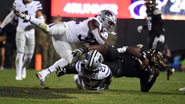 Oct 12, 2024; Boulder, Colorado, USA; Colorado Buffaloes quarterback Shedeur Sanders (2) is tackled by Kansas State Wildcats