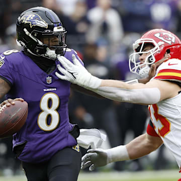 Jan 28, 2024; Baltimore, Maryland, USA; Baltimore Ravens quarterback Lamar Jackson (8) prepares to throw the ball as Kansas City Chiefs linebacker Drue Tranquill (23) defends during the first half in the AFC Championship football game at M&T Bank Stadium. Mandatory Credit: Geoff Burke-Imagn Images