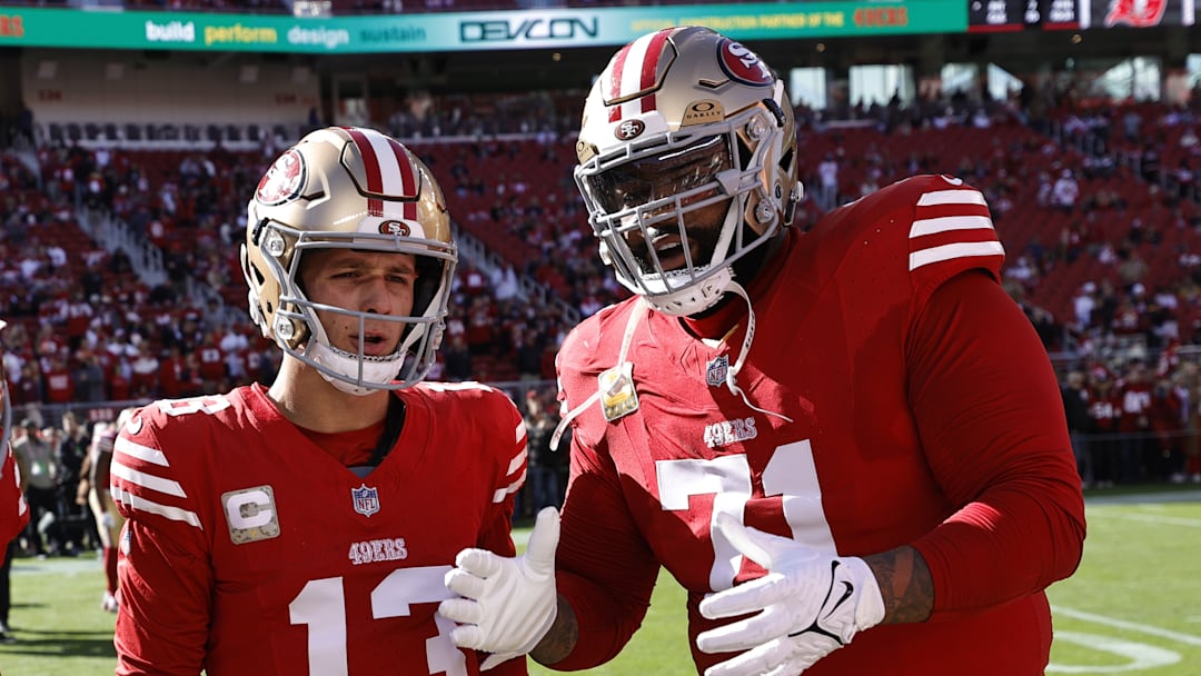 San Francisco 49ers quarterback Brock Purdy (L) and left tackle Trent Williams (L)