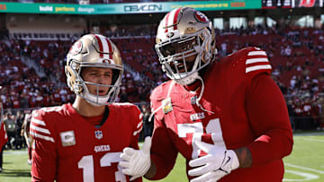 San Francisco 49ers quarterback Brock Purdy (L) and left tackle Trent Williams (L)