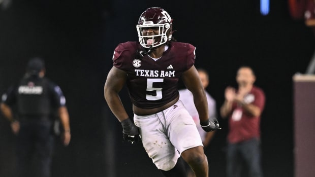 Texas A&M Aggies defensive lineman Shemar Stewart reacts after a tackle during a college football game in the SEC.