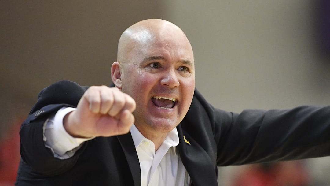 Head coach Casey Alexander gives instructions to his team.