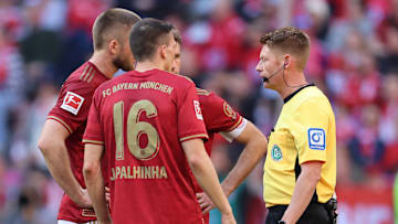 Bayern Munich players arguing with referee after Joao Palhinha was sent off against Bochum.