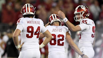 Jan 2, 2020; Jacksonville, Florida, USA; Indiana Hoosiers place kicker Logan Justus (82) is consoled by teammate long snapper Sean Wracher (95) after missing the go ahead field goal during the fourth quarter against the Tennessee Volunteers at TIAA Bank Field. Mandatory Credit: Douglas DeFelice-Imagn Images