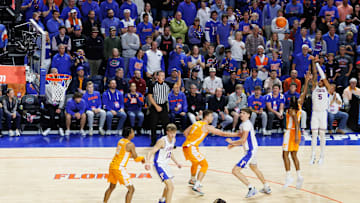 Jan 7, 2025; Gainesville, Florida, USA; Florida Gators guard Will Richard (5) shoots a three point basket over Tennessee Volunteers guard Chaz Lanier (2) during the second half at Exactech Arena at the Stephen C. O'Connell Center. Mandatory Credit: Matt Pendleton-Imagn Images