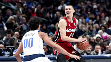 Feb 13, 2025; Dallas, Texas, USA; Miami Heat guard Tyler Herro (14) controls the ball as Dallas Mavericks guard Max Christie (00) defends during the second half at American Airlines Center. Mandatory Credit: Kevin Jairaj-Imagn Images