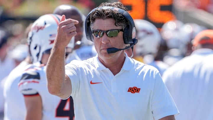 Oklahoma State head coach walks on the sidelines in the first half during an NCAA football game between Oklahoma State and Tulsa in Tulsa, Okla., on Saturday, Sept. 14, 2024.