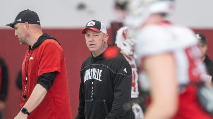 Louisville head football coach Jeff Brohm oversees practice on April 12, 2024 before the Red-White scrimmage game.