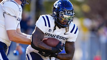 Oct 26, 2024; Laramie, Wyoming, USA; Utah State Aggies running back Rahsul Faison (3) warms up before the game against the Wyoming Cowboys at Jonah Field at War Memorial Stadium. Mandatory Credit: Troy Babbitt-Imagn Images