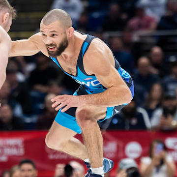 Thomas Gilman (right) wrestles Spencer Lee in the 57-kilogram men's freestyle championship series during the 2024 U.S. Olympic Team Trials in State College.