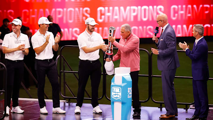 Arthur Blank presents the SoFi Cup to Patrick Cantlay after Atlanta Drive GC won the inaugural TGL championship series