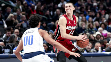 Feb 13, 2025; Dallas, Texas, USA; Miami Heat guard Tyler Herro (14) controls the ball as Dallas Mavericks guard Max Christie (00) defends during the second half at American Airlines Center. Mandatory Credit: Kevin Jairaj-Imagn Images