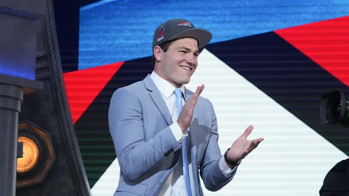 North Carolina Tar Heels quarterback Drake Maye reacts after being selected in the 2024 NFL Draft. North Carolina Tar Heels quarterback Drake Maye reacts after being selected in the 2024 NFL Draft.