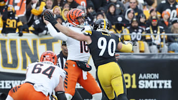 Nov 16, 2025; Pittsburgh, Pennsylvania, USA; Cincinnati Bengals quarterback Joe Flacco (16) looks to pass the ball as Pittsburgh Steelers linebacker T.J. Watt (90) defends during the first half at Acrisure Stadium. Mandatory Credit: Charles LeClaire-Imagn Images
