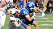 Nov 8, 2025; Lubbock, Texas, USA;  Brigham Young Cougars wide receiver parker Kingston (11) is tackled by Texas Tech Red Raiders defensive back Jacob Rodriguez (10) in the first half at Jones AT&T Stadium. Mandatory Credit: Michael C. Johnson-Imagn Images