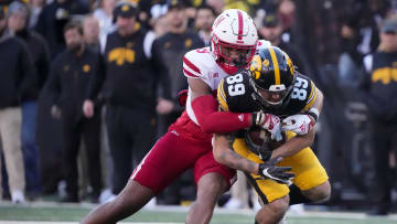 Iowa receiver Nico Ragaini is tackled by Nebraska's Javin Wright in the second quarter during a NCAA football game on Friday, Nov. 25, 2022, at Kinnick Stadium in Iowa City.