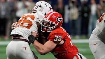 Georgia linebacker Chaz Chambliss (32) stops Texas running back Quintrevion Wisner (26) during the second half of the SEC championship game against Texas.