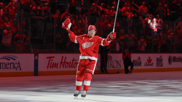 Mar 19, 2024; Detroit, Michigan, USA; Lucas Raymond celebrates the Red Wings win over the Columbus Blue Jackets following the game at Little Caesars Arena. Mandatory Credit: Brian Bradshaw Sevald-USA TODAY Sports