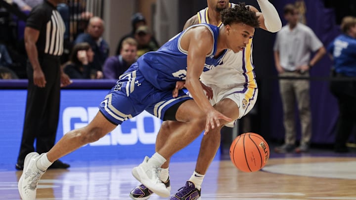 Nov 17, 2022; Baton Rouge, Louisiana, USA; New Orleans Privateers guard Preston Murphy Jr. (23) dribbles against LSU Tigers guard Justice Hill (3) during the first half at Pete Maravich Assembly Center. Mandatory Credit: Stephen Lew-Imagn Images Nov 17, 2022; Baton Rouge, Louisiana, USA; New Orleans Privateers guard Preston Murphy Jr. (23) dribbles against LSU Tigers guard Justice Hill (3) during the first half at Pete Maravich Assembly Center. Mandatory Credit: Stephen Lew-Imagn Images
