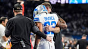 Detroit Lions safety Brian Branch (32) with help of Lions staff, walk off the field due to an injury against Cowboys