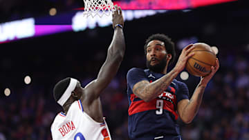 Mar 26, 2025; Philadelphia, Pennsylvania, USA; Washington Wizards forward Justin Champagnie (9) drives against Philadelphia 76ers center Adem Bona (30) during the second quarter at Wells Fargo Center. Mandatory Credit: Bill Streicher-Imagn Images